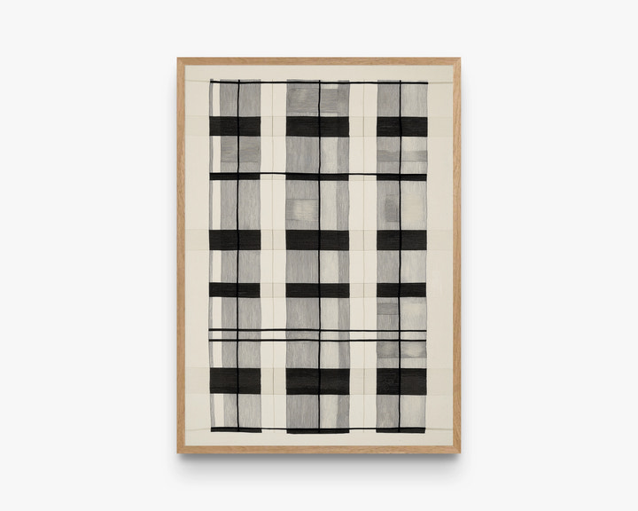 Framed abstract art with black and white pattern on a white background